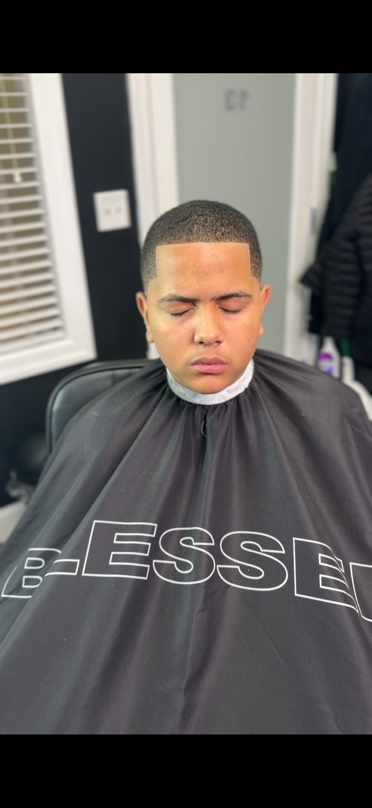 Clean fade haircut, front view, by Larry The Barber