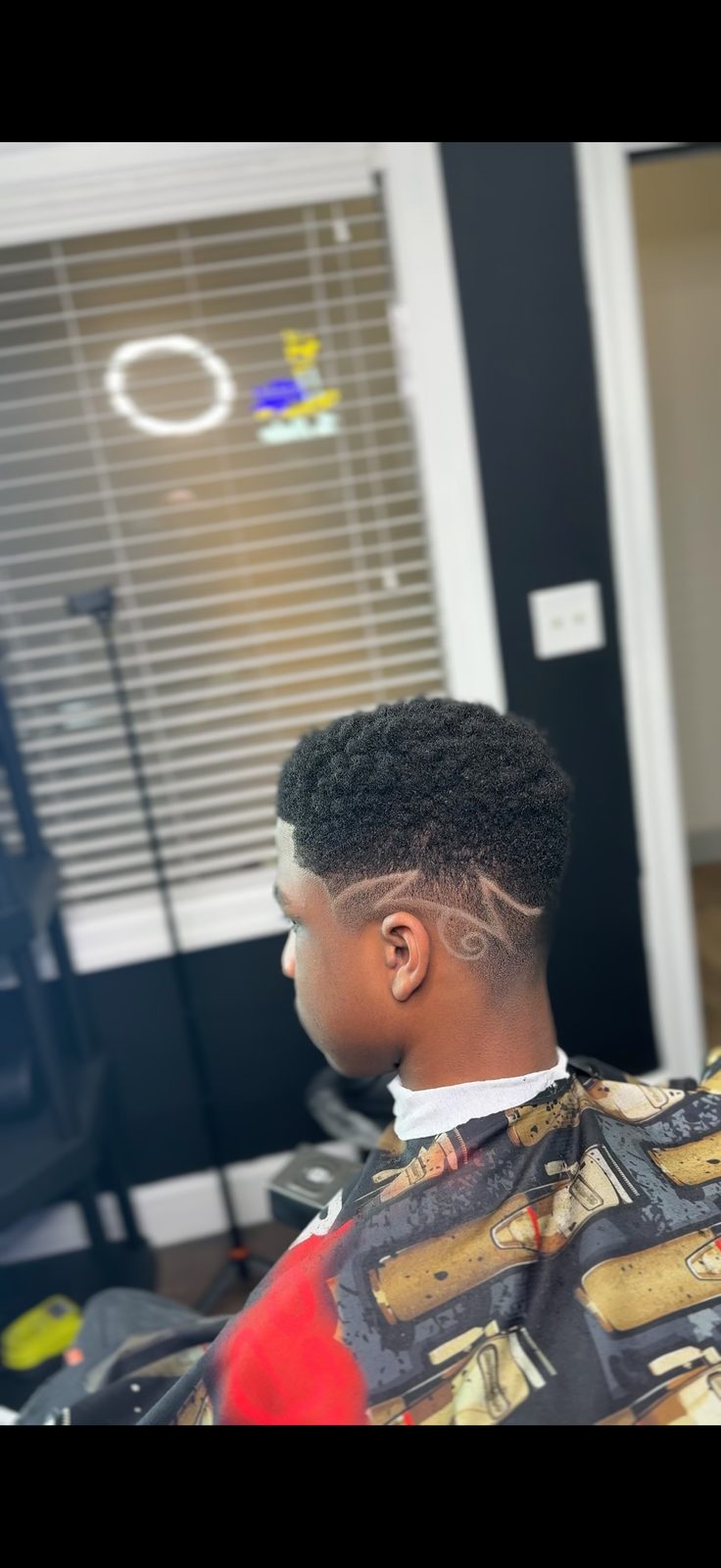 Teen fade with hair design by Larry The Barber